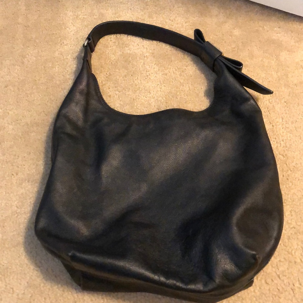 Black Kate Spade bag with bow on the strap